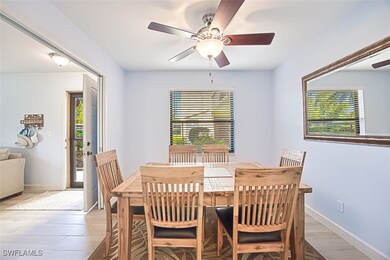 Dining space featuring baseboards and a ceiling fa