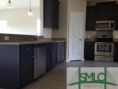 Kitchen with granite counter tops and stainless st