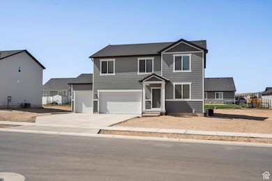 Traditional-style home featuring driveway and an attached garage