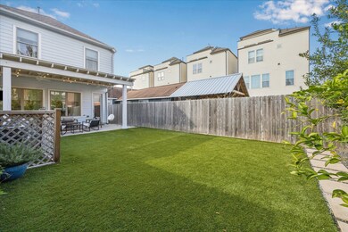 Large, turfed backyard.