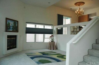 High ceiling living room and stepped up dining are
