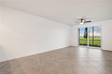 Spare room featuring ceiling fan and light tile floors