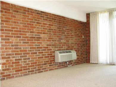 Brick wall adds interest.
