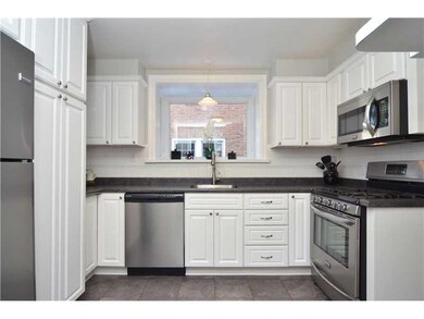 Kitchen. Cheerful white kitchen with greenhouse wi