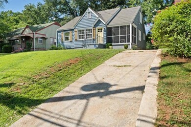 View of front of house featuring a screened porch