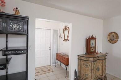 Formal entry features large hall closet.