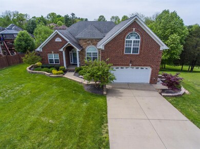 Notice the meticulous landscaping around the home