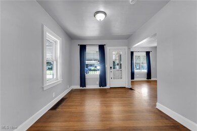 Entrance foyer featuring wood finished floors