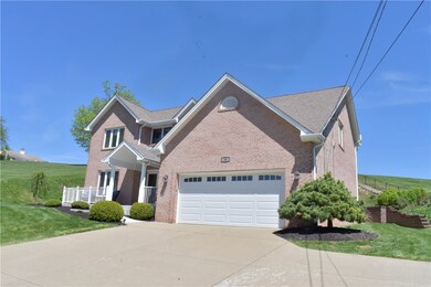 nice landscaping and a two car garage