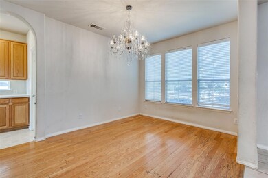 Unfurnished dining area with a chandelier and ligh