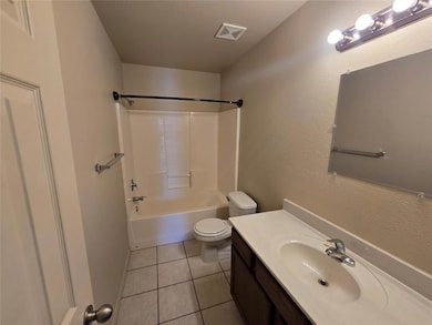 Full bathroom with toilet, vanity,  shower combina