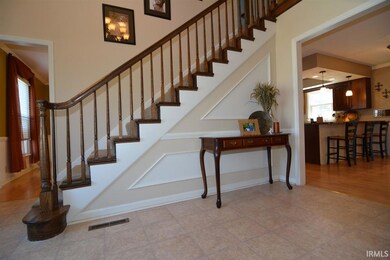 Entry leads up the beautiful stairway to 4 bedroom