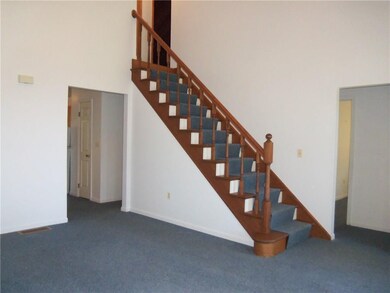 CATHEDRAL CEILING LIVING ROOM WITH STAIRS TO 2ND F