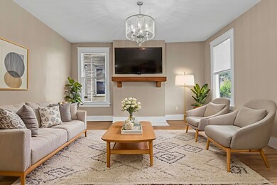 Living room with a chandelier and wood finished floors