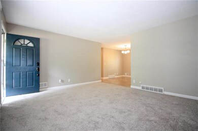 Living room with new carpet and fresh paint!