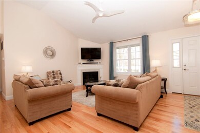Open floor plan includes a living room with vaulte