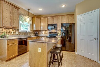 Kitchen has silestone countertops, under cabinet lighting & GE appliances