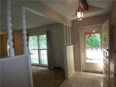 Front entry hallway with tile floor.