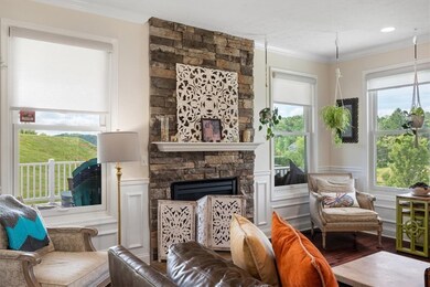 family room is full of windows ovverlooking rear y
