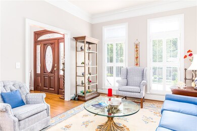 Foyer and Formal Living Room with crown molding &