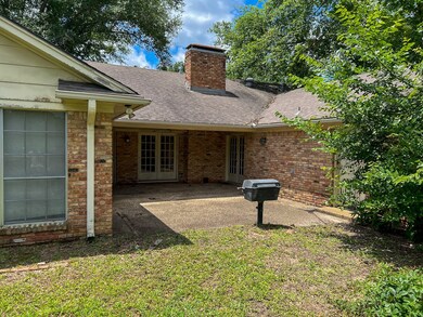 Back porch, accessed by a garage door, kitchen doo