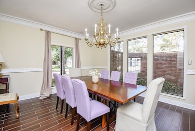 Elegant dining room with crown molding and a view