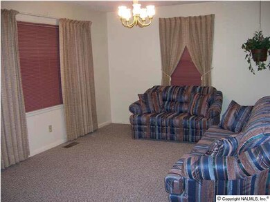 Front entry is just to the left of double window