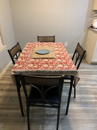 Dining room featuring light wood-style flooring a