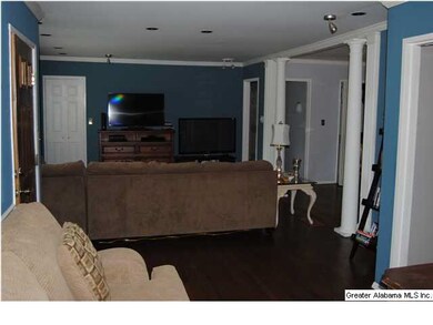 Den, to left of front door.