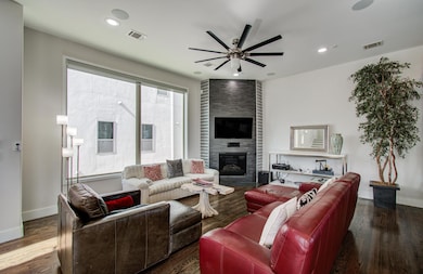 A cozy fireplace is the center of this large livin