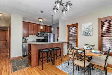 Cherry cabinetry w/SS appliances & breakfast bar!