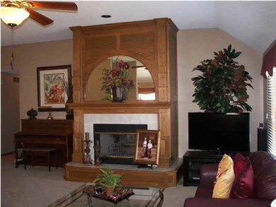 The woodwork around the fireplace shows the qualit