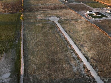 Aerial view of sparsely populated area featuring extensive farmland
