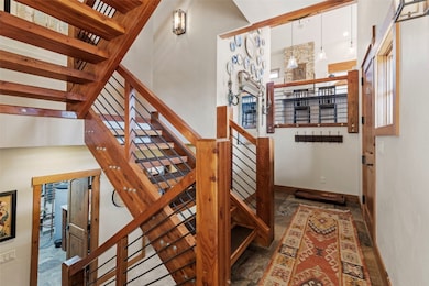 Custom glue-lam staircase; granite tile entry floo