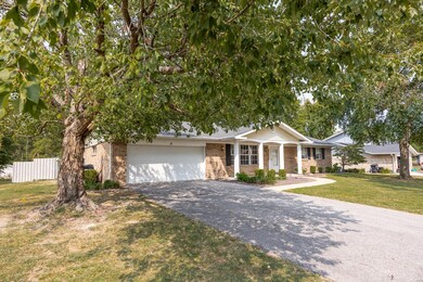 2- CAR OVERSIZED GARAGE with very usable Attic Space