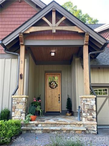 A welcoming entrance with stone and wood accents