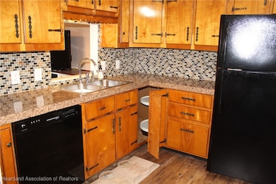Solid wood cabinets tiled back splash