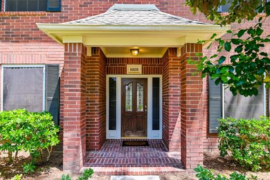 Covered porch and Solar screens across front of home