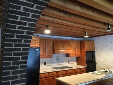 Kitchen through brickwork in living room
