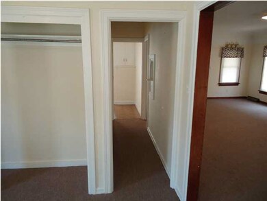VIEW OF HALLWAY TO BATHROOM AND KITCHEN FROM THE B