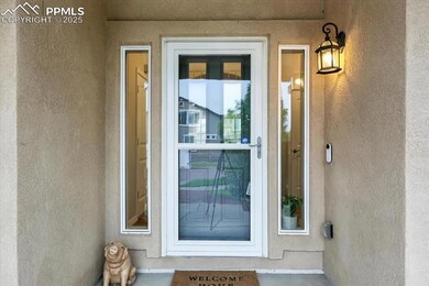 Entrance to property featuring stucco siding