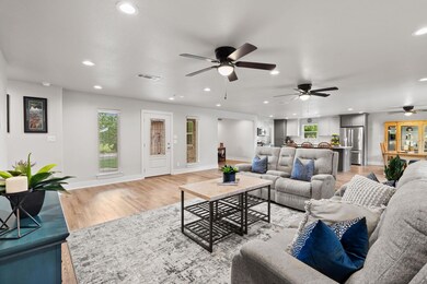Living room with recessed lighting, ceiling fan, 