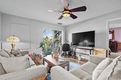 Living room featuring wood-type flooring and ceili
