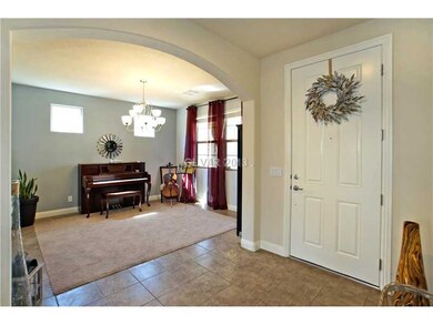 Property Photo. Entry of the home with sitting are