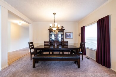 Spacious formal dining room with a large picture w