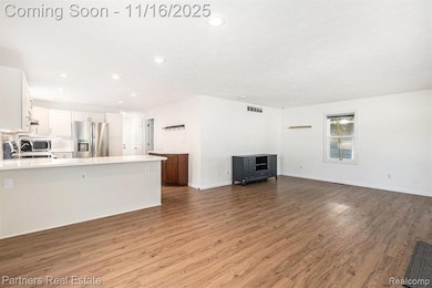 Dining Area opens to the Kitchen and Living Room and can accommodate bar seating at the peninsula and a nice sized dining table.