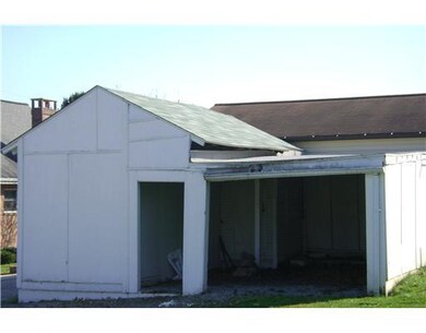 Parking Lot/Garage. Carport in rear with shed also