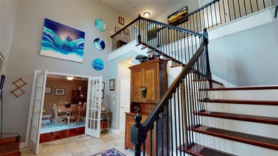 Welcome your guests into the grand two-story foyer