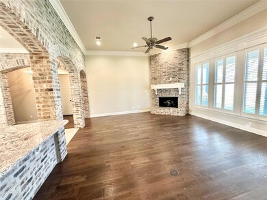 Unfurnished living room with a fireplace, dark har