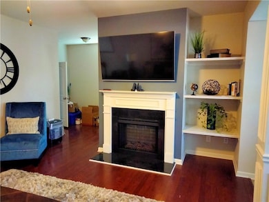 Living room featuring dark wood-type flooring